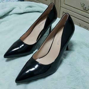 Black patent stilletoes. 5 inch heels.